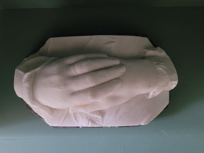 Carved marble hands