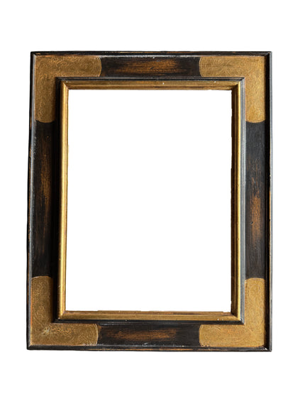 A gold and black renaissance style frame