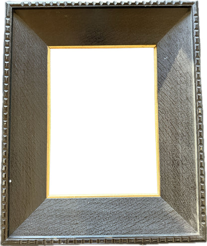 Dark wood frame with gilt inner slip