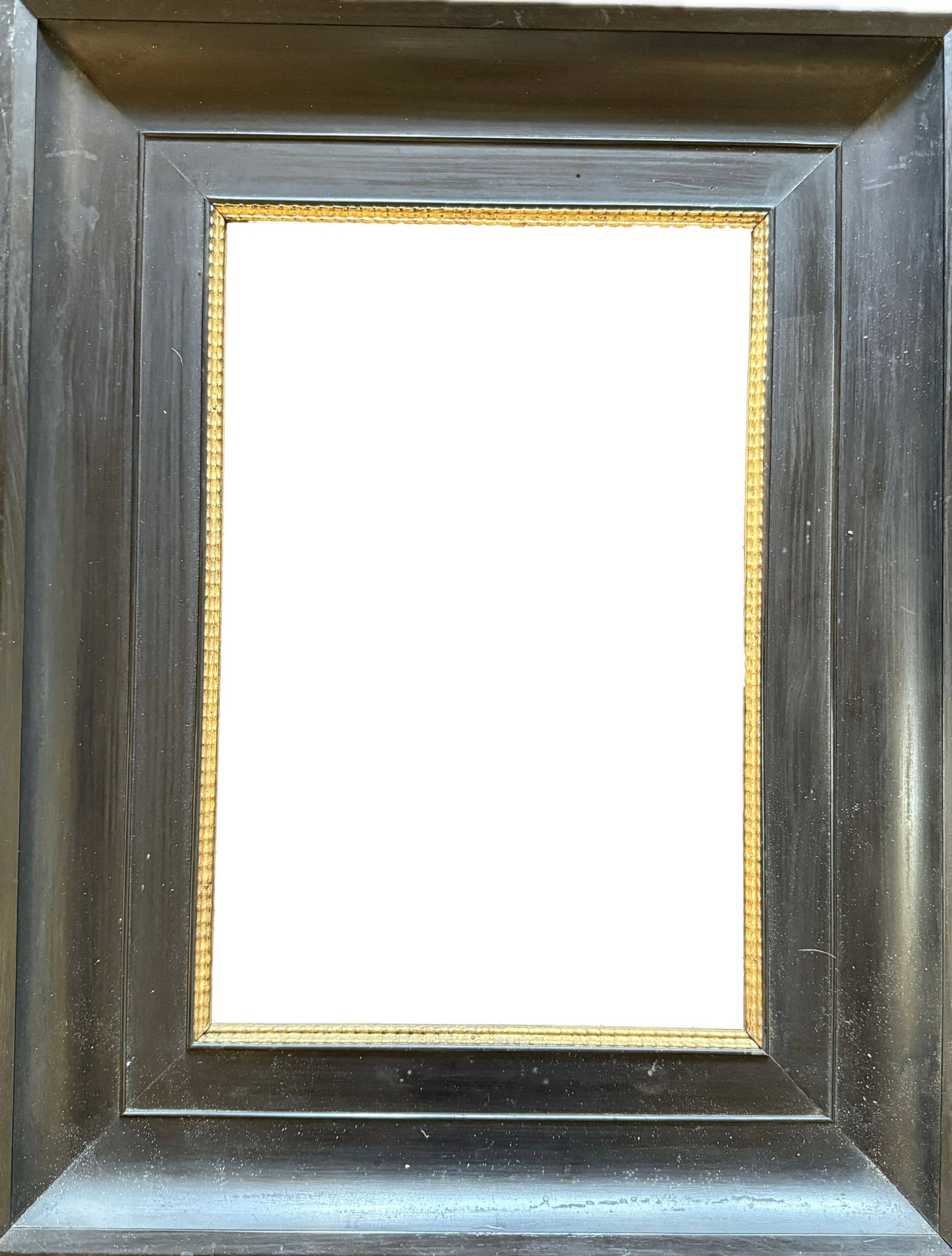 Dark wood frame with gilt ripple inner slip