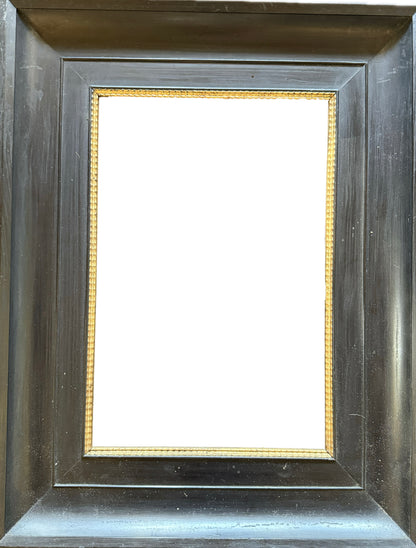Dark wood frame with gilt ripple inner slip