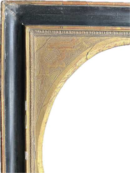Italian 18th century black and gold frame with oval slip