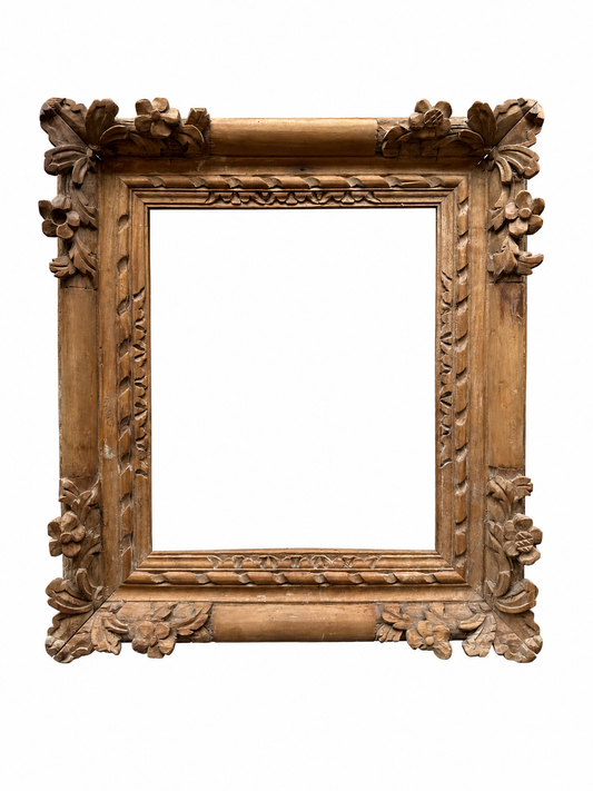 A late 18th century stripped Louis XV carved frame